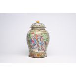 A fine Chinese Canton famille rose vase and cover with palace scenes and floral design, 19th C.