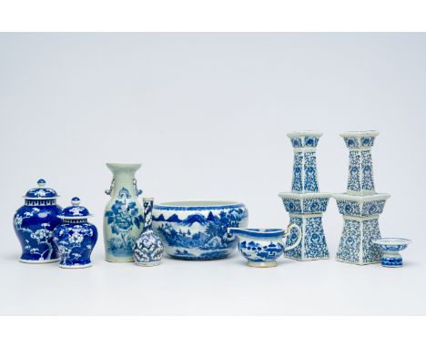 A varied collection of Chinese blue and white porcelain, 19th/20th C.H 20,5 - 16,5 cm (prunus vases)  H 32 - 31,5 cm (candle 