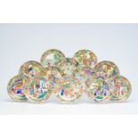 Twelve Chinese Canton famille rose plates with an animated design, 19th C.