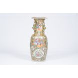 A large and fine Chinese Canton famille rose vase with palace scenes, birds and butterflies among bl