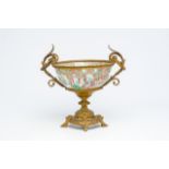 A Chinese Canton famille rose bowl with gilt bronze mounts, 19th C.
