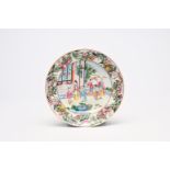 A fine Chinese Canton famille rose plate with a scholar at his desk, 19th C.