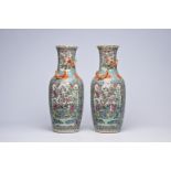 A pair of Chinese Canton famille rose turquoise ground vases with birds among blossoming branches, 1