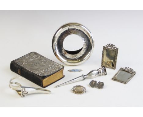 A selection of silver ladies accessories, to include a silver posy holder, dated London 1955, of cornucopia form with beaded 