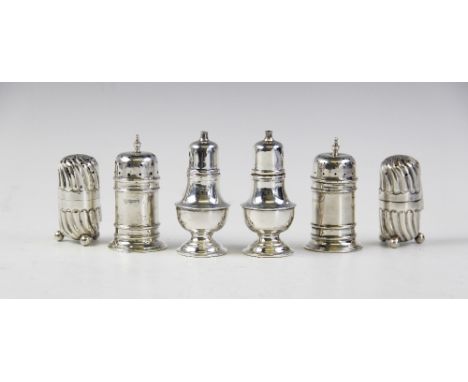 A pair of silver pepperettes by Adie Brothers, Birmingham 1936-37, of baluster form on stepped circular foot with pull-off co