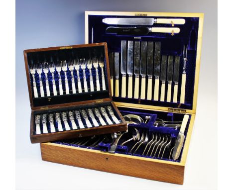 A large silver plated canteen of cutlery, comprising forks, spoons, knives, teaspoons, serving ladles, sugar tongs, knife res