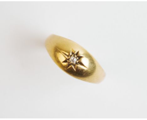 An Edwardian diamond set 18ct gold ring, Chester 1903, comprising a central single cut diamond claw set to a plain polished 1