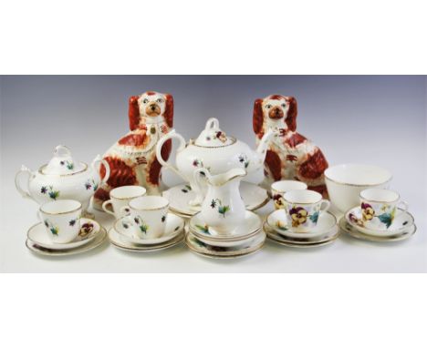 A hand painted florally decorated Staffordshire tea service, late 19th/early 20th century, comprising: a teapot and cover, se