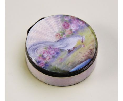 A George V silver and enamel pill box, import marks for Erich Kellerman, London 1912, of circular form with pink guilloche en
