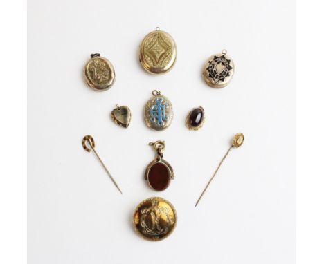 A Victorian enamel locket pendant, the oval shaped pendant with engraved detailing to exterior and monogrammed initials to fr