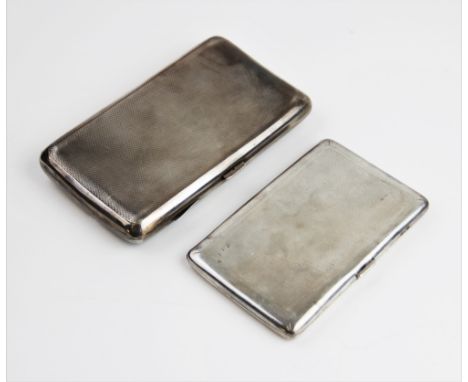 A George V silver cigarette case by Cohen &amp; Charles, London 1930, of rectangular form with engine turned decoration and m