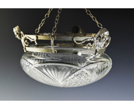 An Edwardian cut glass plafonnier, of typical compressed form and fitted with silvered mounts with mask terminals, 32cm wide 