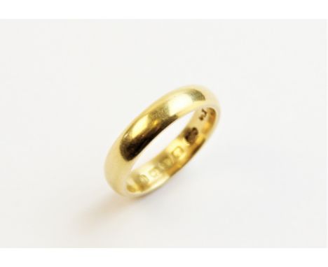An 18ct gold wedding band, ring size L, weight approx. 5.4gms 