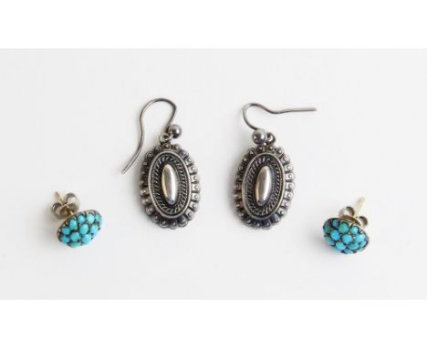 A pair of Victorian silver drop earrings, each designed as an oval drop with beaded detail and hoop fittings, 2.8cm long, tog