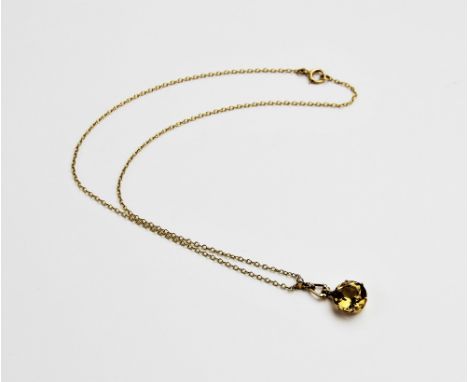 A smokey quartz and pearl set 9ct gold pendant, comprising a round mixed cut smokey quartz measuring 12mm diameter, surmounte