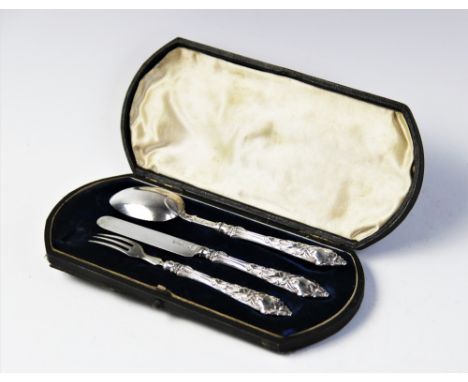 A Victorian silver christening set comprising a spoon, fork and knife by George Unite &amp; Sons, 1869, each with foliate emb