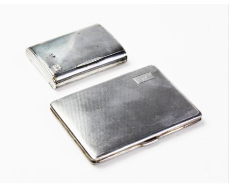 A George V silver cigarette case by E J Trevitt &amp; Sons, Chester 1933, of rectangular form with engine turned decoration a