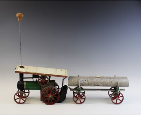 A Mamod model steam traction engine and lumber trailer, the engine with 'Teia' name plate to the front, complete with four wh