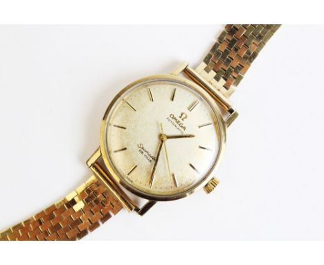 An Omega Seamaster De Ville Automatic wristwatch, the circular champagne dial with baton markers, sweep seconds hand, plain p