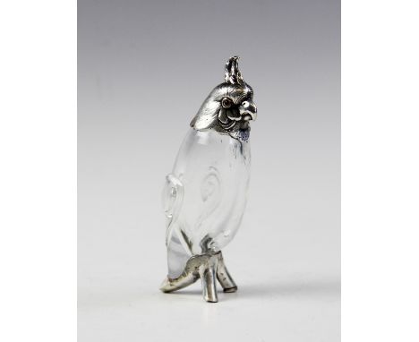 A Victorian silver and glass pepperette modelled as a cockatoo by Henry William Curry, London 1883, clear glass body with app