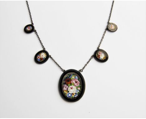A micro-mosaic necklace, comprising five graduating oval panels measuring between 13mm x 10mm and 37mm x 30mm, each decorated