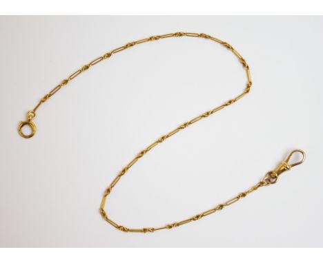 A yellow metal chain, comprising alternating Spiga-link and trombone link sections, with lobster claw and spring-ring fastene