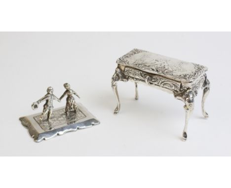 A silver trinket box in the form of a Louis XVI style side table, import marks for Boaz Moses Landeck, Chester 1910, on cabri