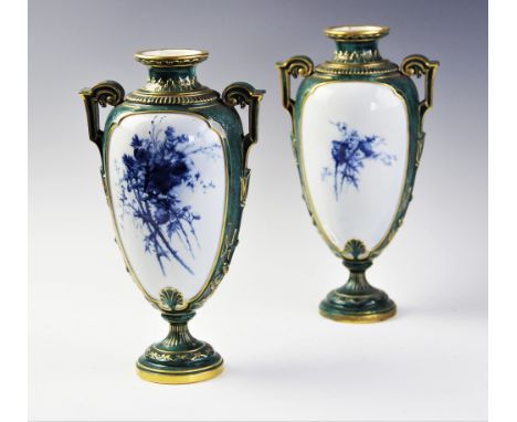 Two Royal Worcester vases, late 19th century, each vase of amphora form with applied stepped handles with scrolling terminals