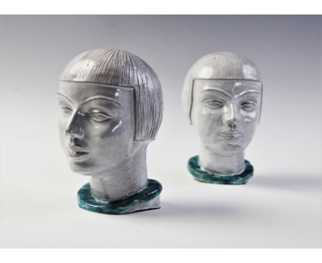 A pair of German Art Deco ceramic heads, circa 1925, the white glazed heads each modelled with typical 1930s bobbed hairstyle