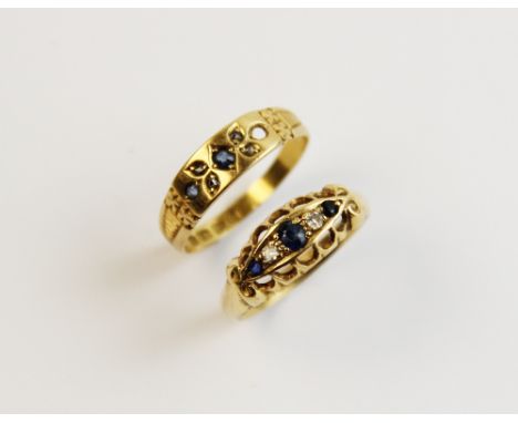 An early 20th century sapphire and diamond 18ct gold ring, dated Birmingham 1915, comprising three mixed cut sapphires inters