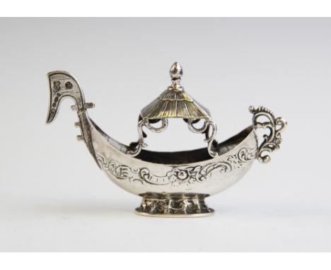 An miniature silver model of a boat, import marks for George Bedingham, Chester 1906, 10.7cm long, weight 58.1gms 