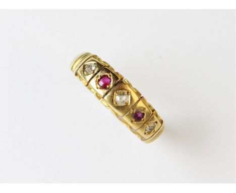 A Victorian 18ct gold diamond and ruby five stone ring, comprising three single cut diamonds interspersed with two mixed cut 
