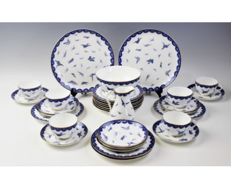 An Edwardian Royal Worcester tea service, early 20th century, comprising; eleven tea cups, eleven saucers, eleven side plates