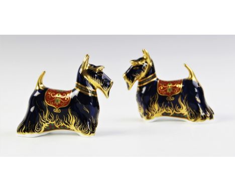 A Royal Crown Derby paperweight, modelled as a Scottish Terrier with gold stopper, 11cm high, with a further matching example