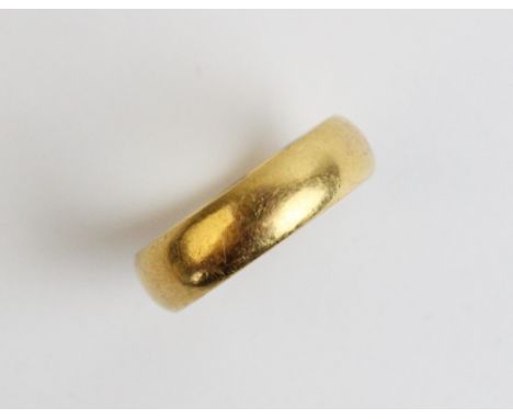 A 22ct yellow gold wedding band, ring size L 1/2, weight 5.5gms 