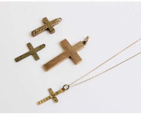 An Edwardian 9ct gold cross pendant, Chester 1902, of plain polished form, 3.3cm x 2.1cm, together with another 9ct gold cros