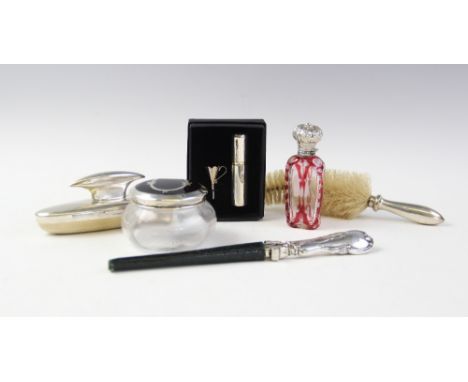 A selection of silver and silver mounted dressing tableware, to include a a silver mounted buffer by Mappin &amp; Webb, Londo