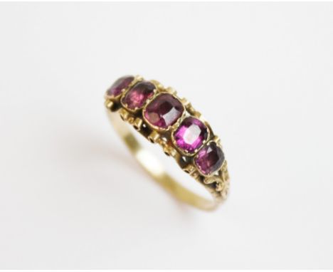 A Victorian five stone amethyst ring, comprising five graduated cushion cut amethysts measuring between 3mm x 3mm and 4mm x 4