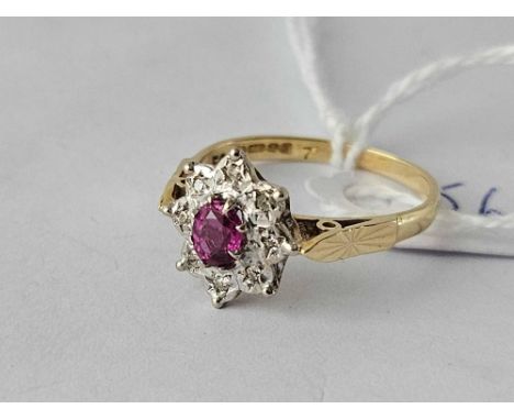A ruby and diamond cluster ring 18ct gold size P  3.5 gms