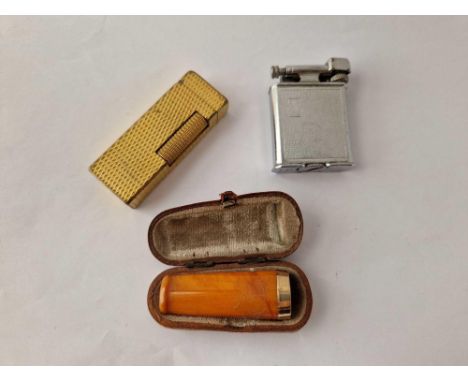 A bag of Dunhill lighter 9ct amber cigar holder etc.