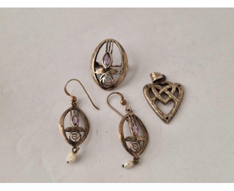 A bag containing silver arts and crafts earrings brooch etc.