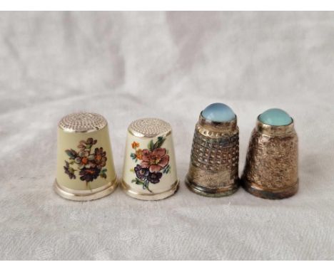 Two silver and enamel thimbles and two others, inset with stones, by HCC &amp; S, Birmingham 1926