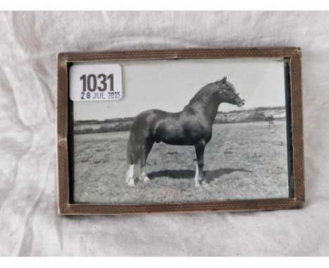 A photo frame with oblong engine turned border, 6” high, Birmingham 1923