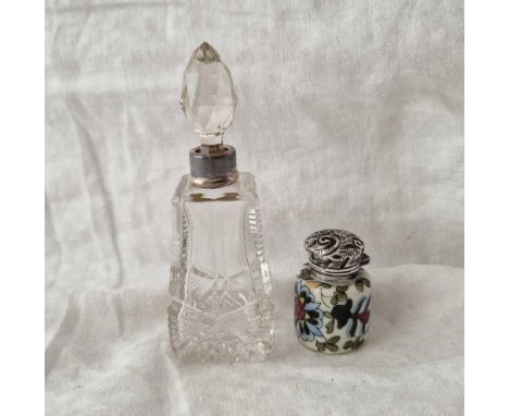 A porcelain mounted scent bottle with stopper and silver hinged cover, Birmingham 1899 and a glass mounted scent bottle