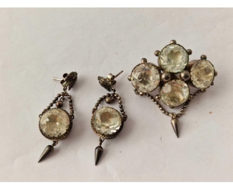 A pair of silver crystal earrings and brooch