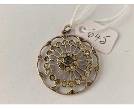A silver and paste circular pendant