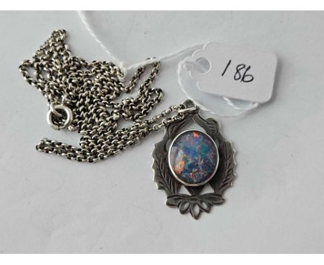 A silver doublet pendant on chain