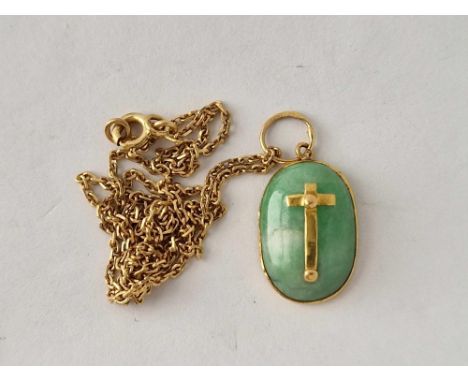 A jade pendant mounted in 18ct gold on 18ct gold chain 5.3g inc