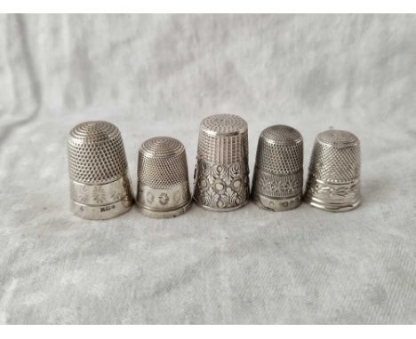 Five various silver thimbles with chased decoration