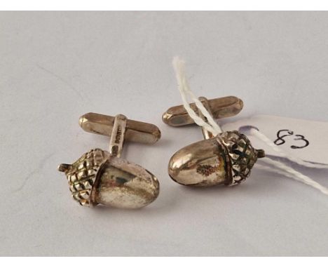 A boxed pair of silver acorn cufflinks